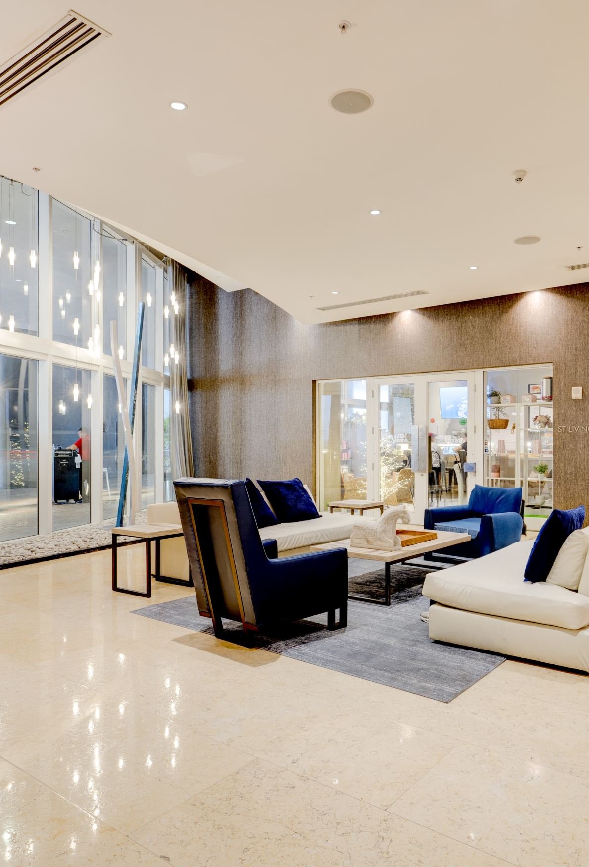 Premium high-rise residential lobby in Brickell with double-height ceilings and designer furniture — Coronado Photo & Media