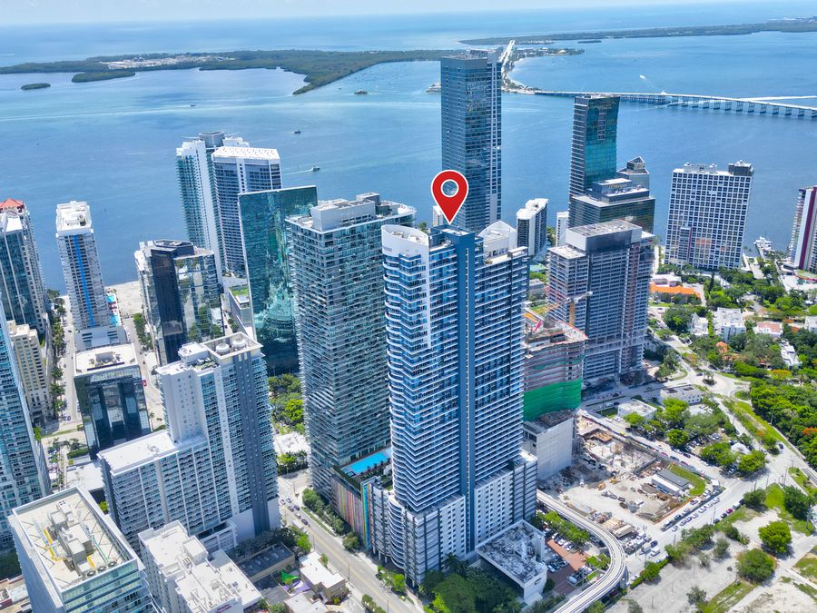 Aerial view of Brickell penthouse tower and Biscayne Bay