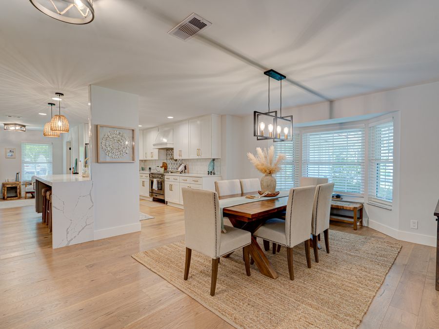 Coral Gables dining room with marble island and pendant lighting